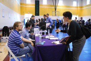 Word Wizards Inc talking to a potential new employee at the WIFV job fair